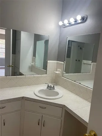 a storage room with wooden floor washer and dryer