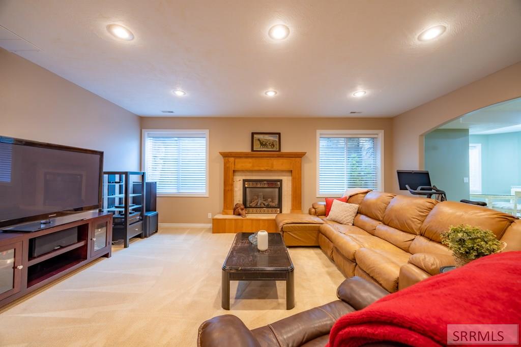 305 Spring Meadows Drive Idaho Falls, ID 83404 - Photo 29 of 66 Basement living room with fireplace