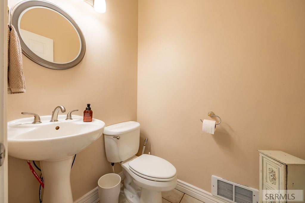 305 Spring Meadows Drive Idaho Falls, ID 83404 - Photo 50 of 66 Main level half bath just off of the laundry room