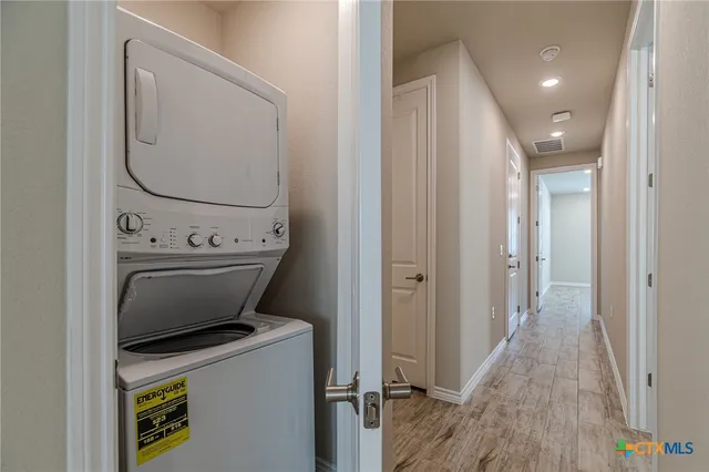 a view of bathroom with a washer and dryer
