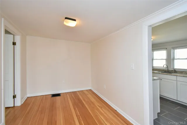 a view of an empty room and window