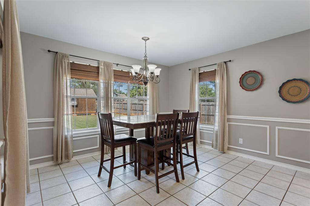 706 Maji Road Whitehouse, TX 75791 - Photo 16 of 37 a view of a dining room with furniture and chandelier