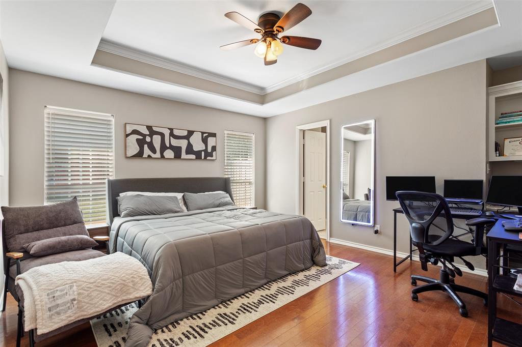 706 Maji Road Whitehouse, TX 75791 - Photo 17 of 37 a bedroom with bed and a chandelier