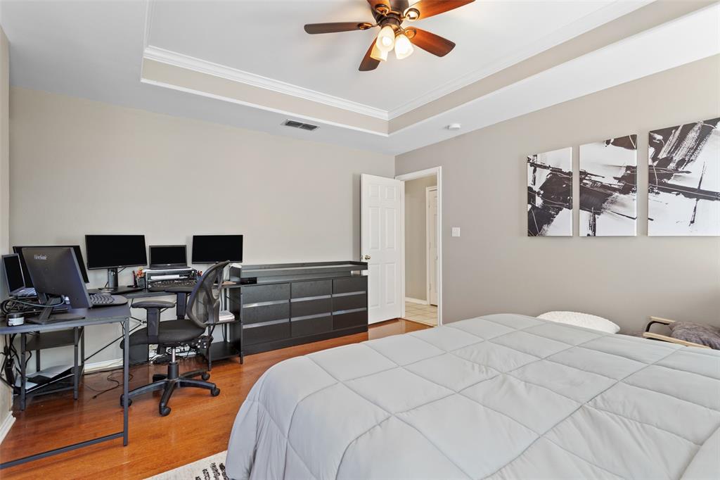 706 Maji Road Whitehouse, TX 75791 - Photo 20 of 37 a bedroom with a bed and wooden floor