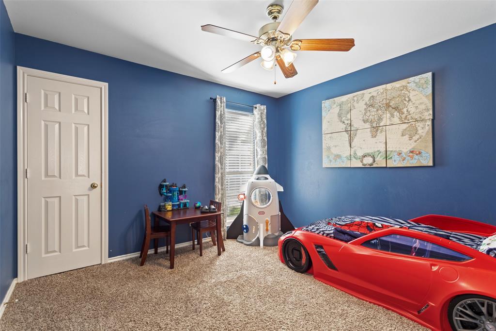 706 Maji Road Whitehouse, TX 75791 - Photo 21 of 37 a bedroom with a bed and a chandelier