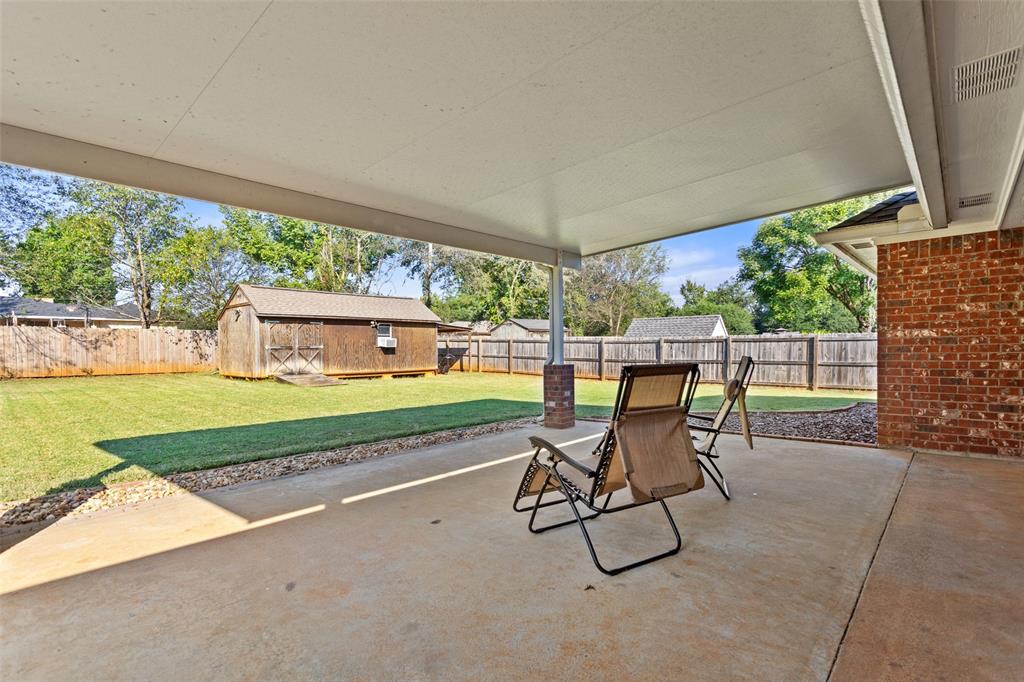 706 Maji Road Whitehouse, TX 75791 - Photo 27 of 37 a view of a patio with table and chairs next to a yard