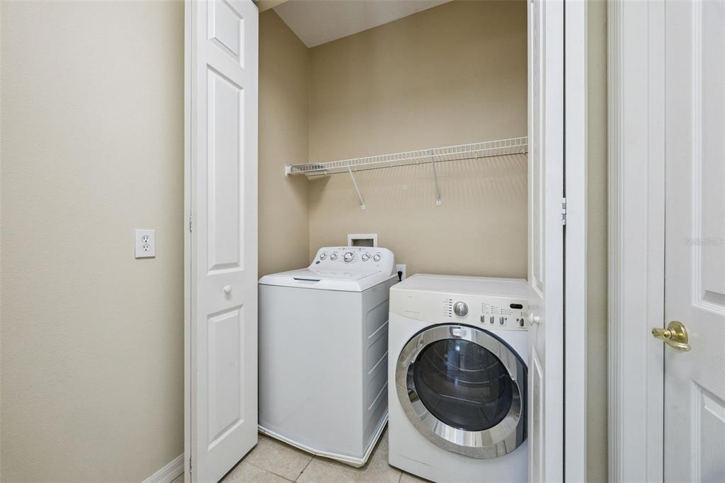 551 Terrace Spring Drive Orlando, FL 32828 - Photo 29 of 41 a utility room with dryer and washer