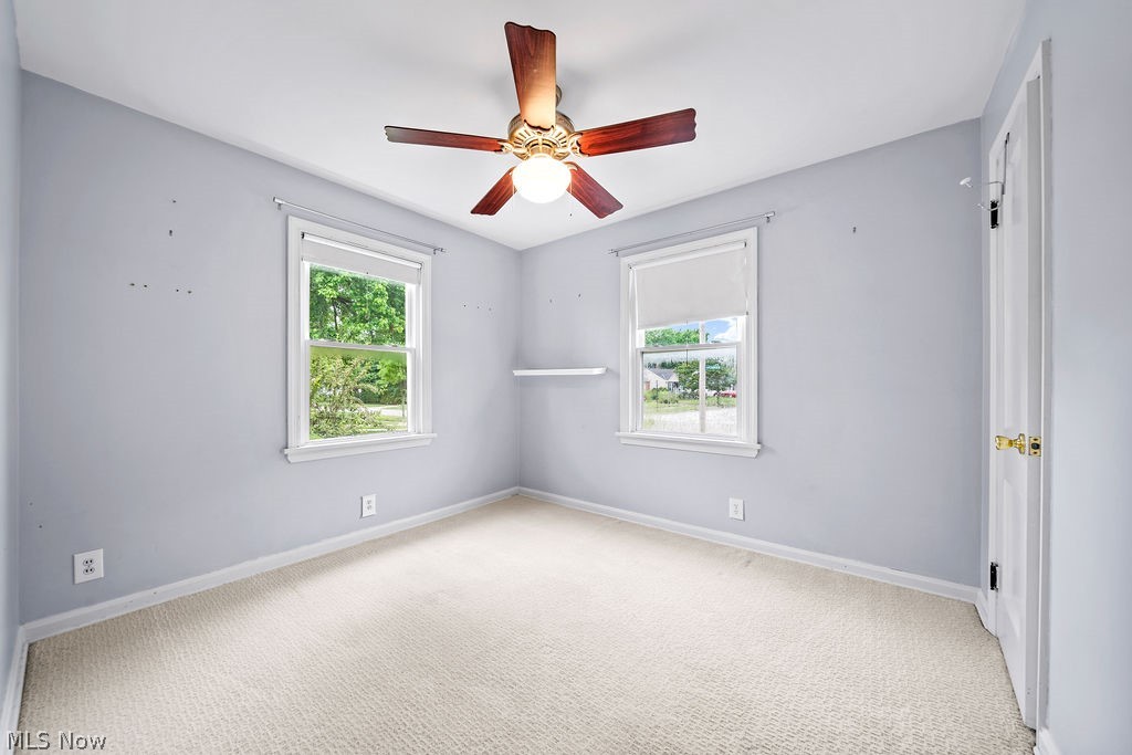 1653 Overbrook Road Cleveland, OH 44124 - Photo 6 of 29 Carpeted spare room featuring ceiling fan