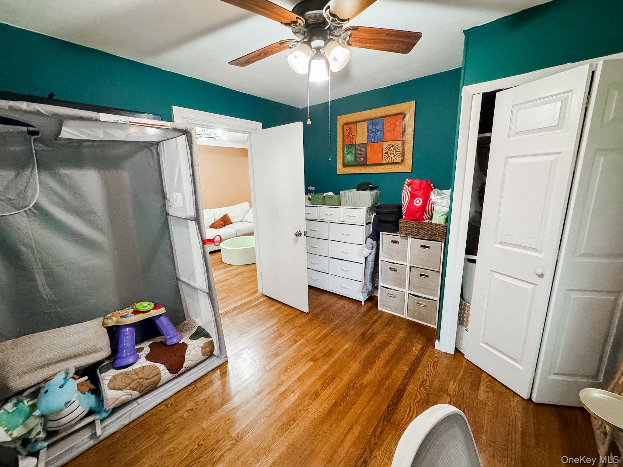 83-25 98th Street, Unit 1P Queens, NY 11421 - Photo 15 of 16 a living room with furniture and a window