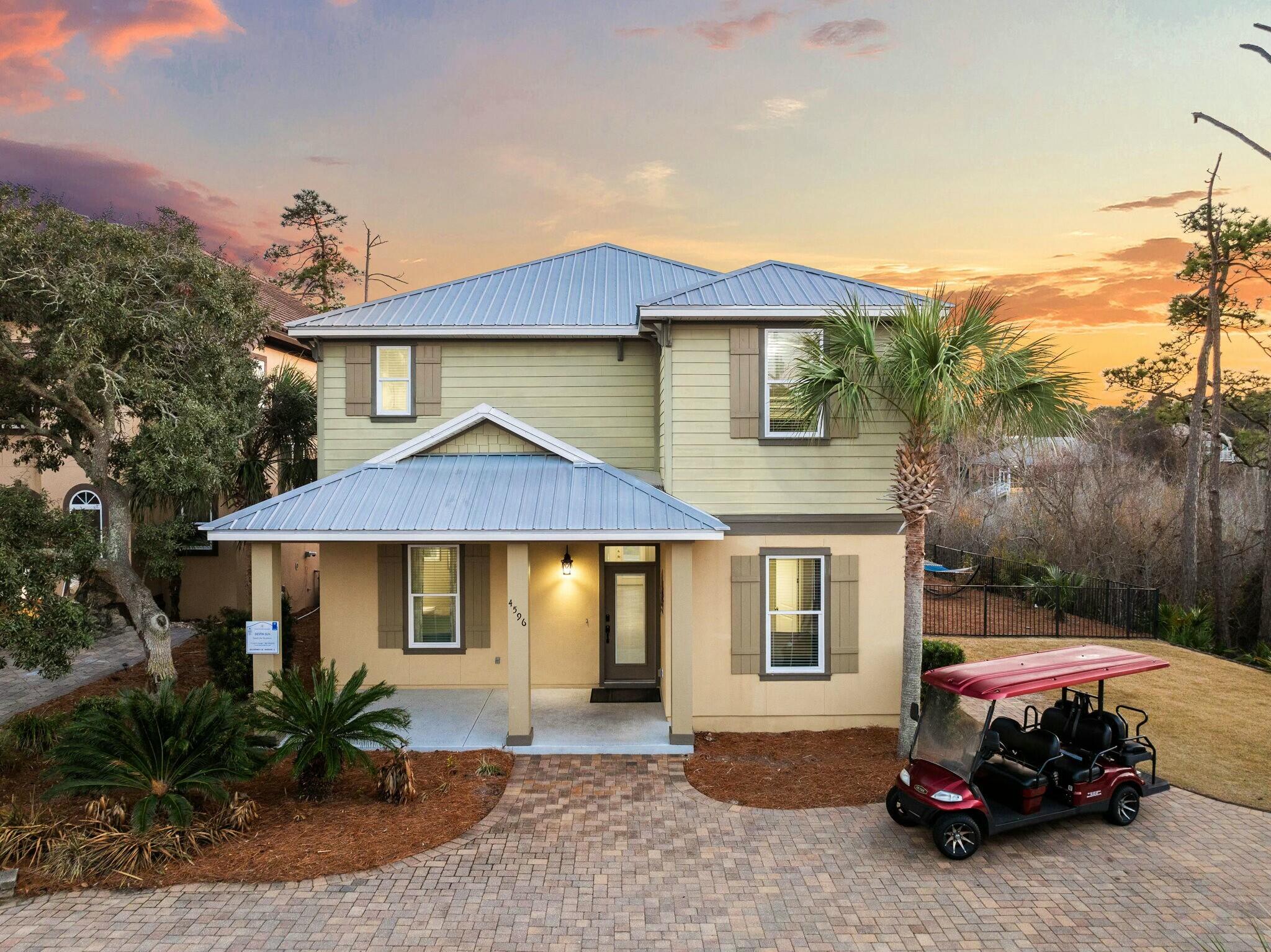 4596 Paradise Isle Destin, FL 32541 - Photo 1 of 60 a car parked in front of a house