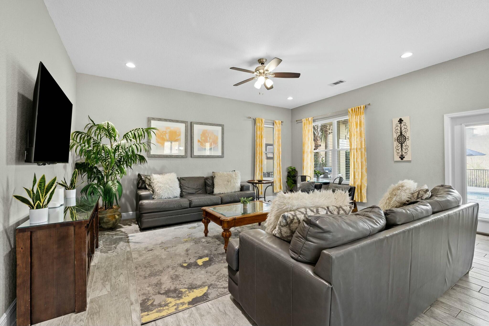 4596 Paradise Isle Destin, FL 32541 - Photo 19 of 60 a living room with furniture and a flat screen tv