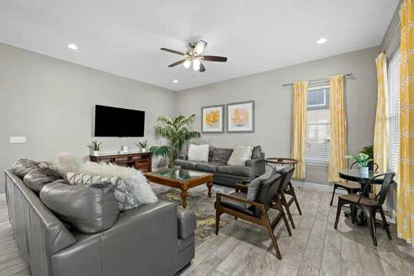 a view of a dining room with furniture and wooden floor