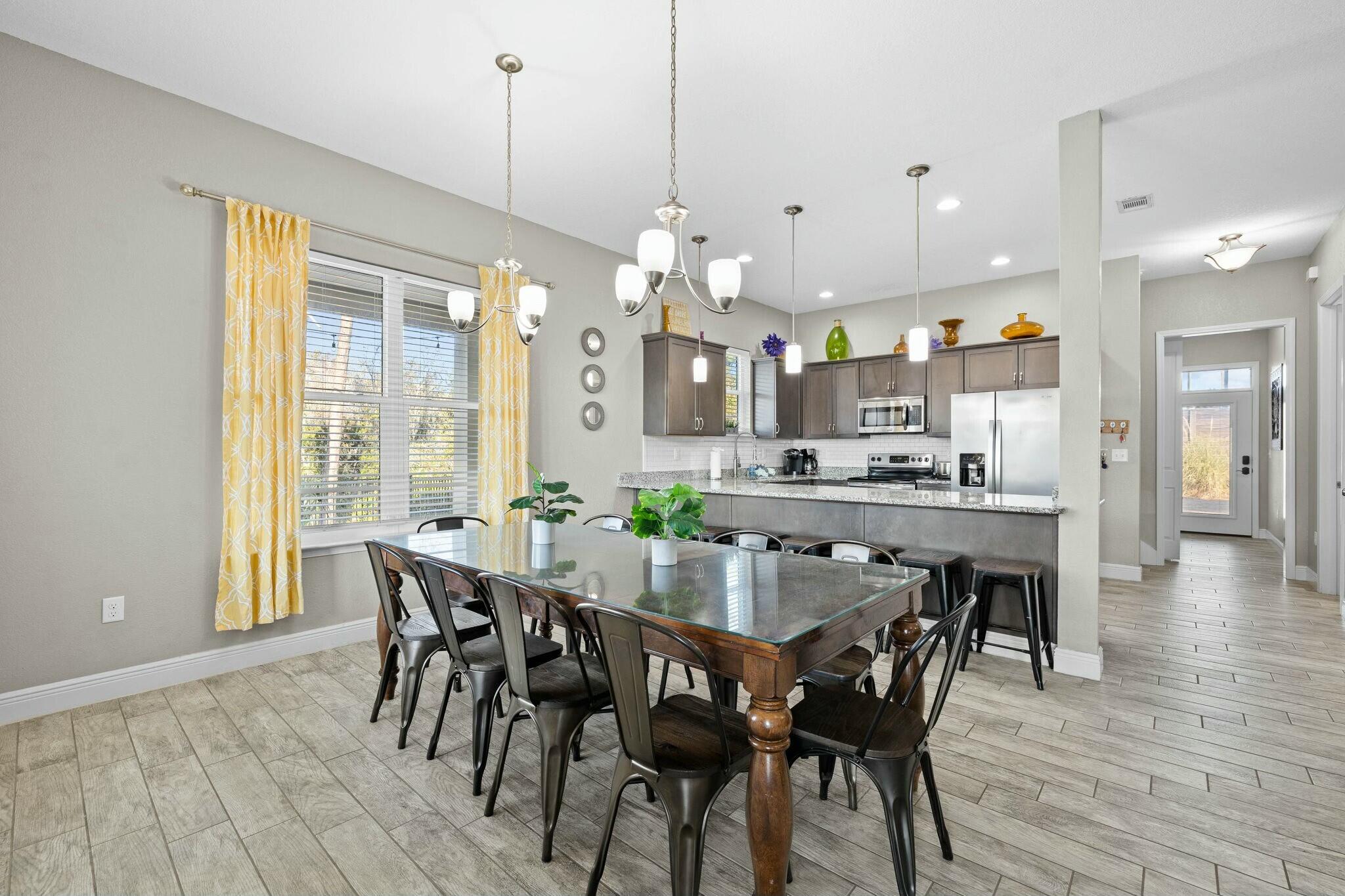 4596 Paradise Isle Destin, FL 32541 - Photo 22 of 60 a view of a dining room with furniture and wooden floor