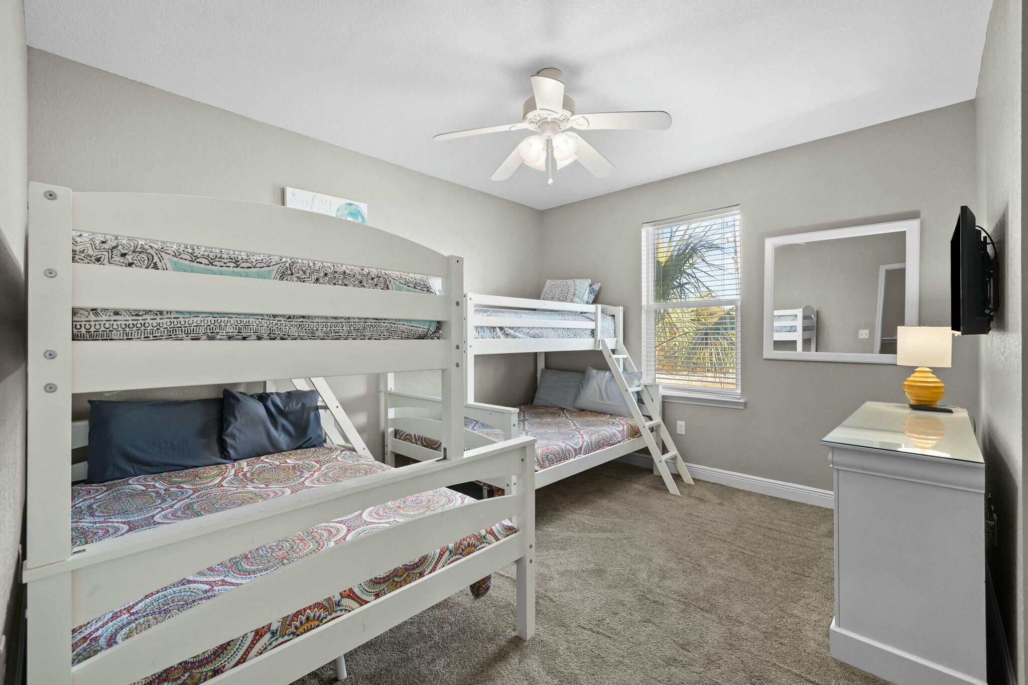 4596 Paradise Isle Destin, FL 32541 - Photo 31 of 60 a bedroom with furniture and a chandelier