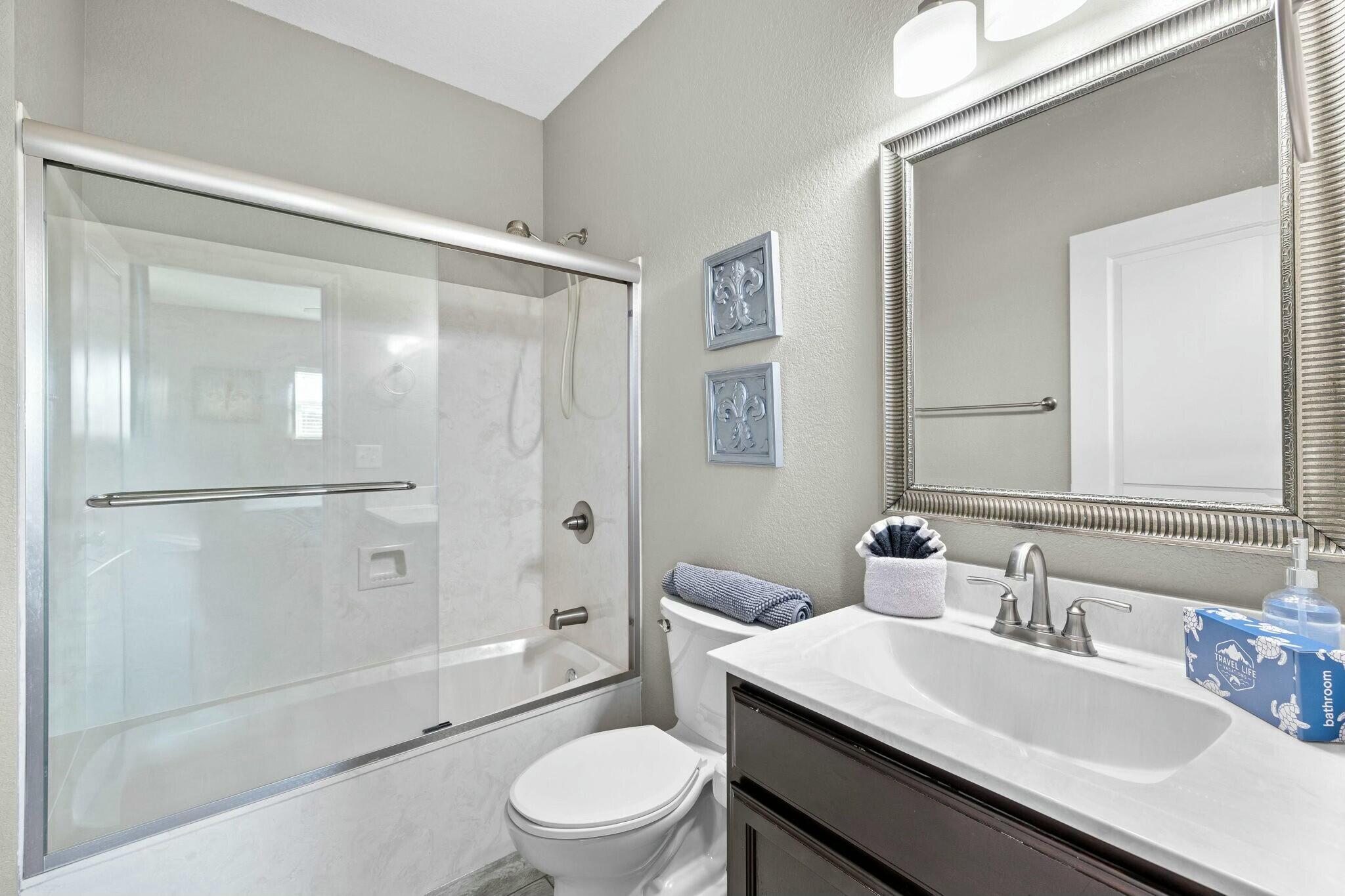 4596 Paradise Isle Destin, FL 32541 - Photo 40 of 60 a bathroom with a sink a toilet and shower