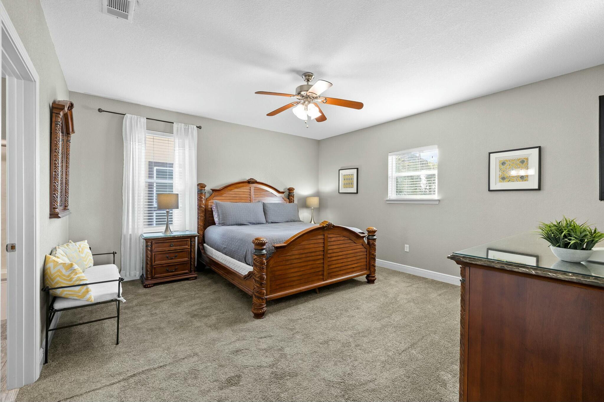4596 Paradise Isle Destin, FL 32541 - Photo 41 of 60 a bedroom with a bed and a chandelier