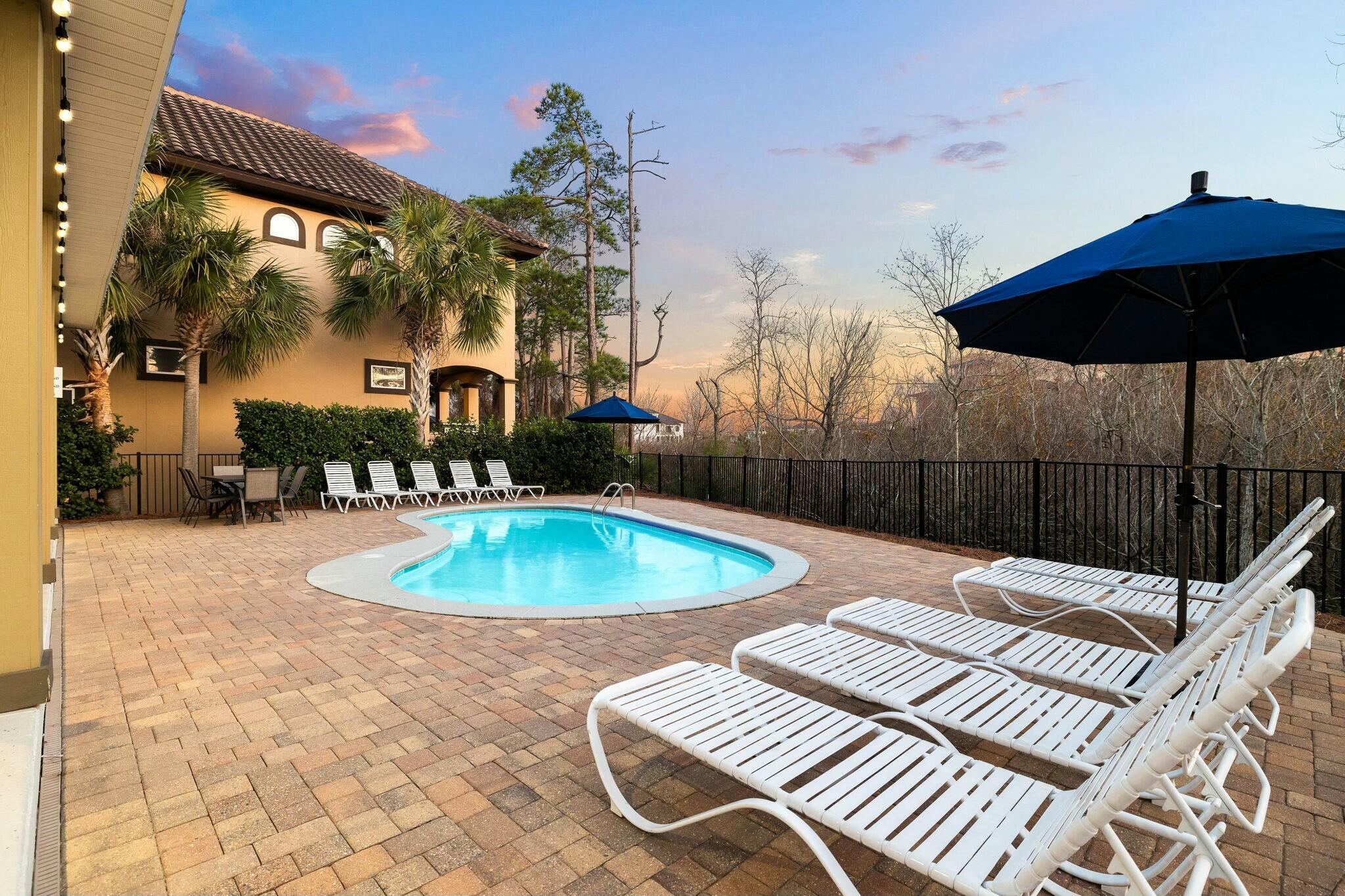 4596 Paradise Isle Destin, FL 32541 - Photo 5 of 60 a view of a swimming pool with a patio