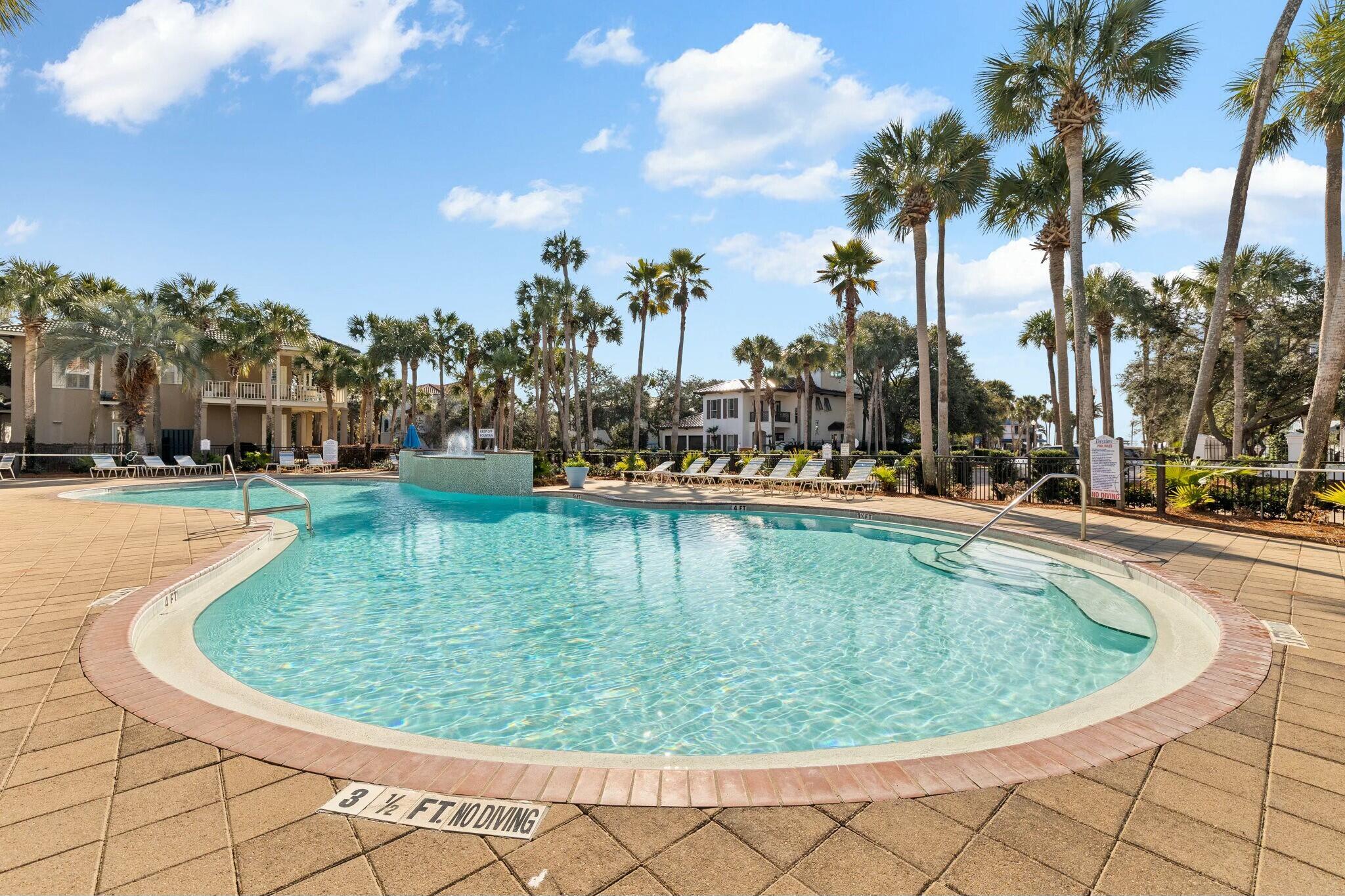 4596 Paradise Isle Destin, FL 32541 - Photo 52 of 60 a view of a swimming pool with outdoor seating