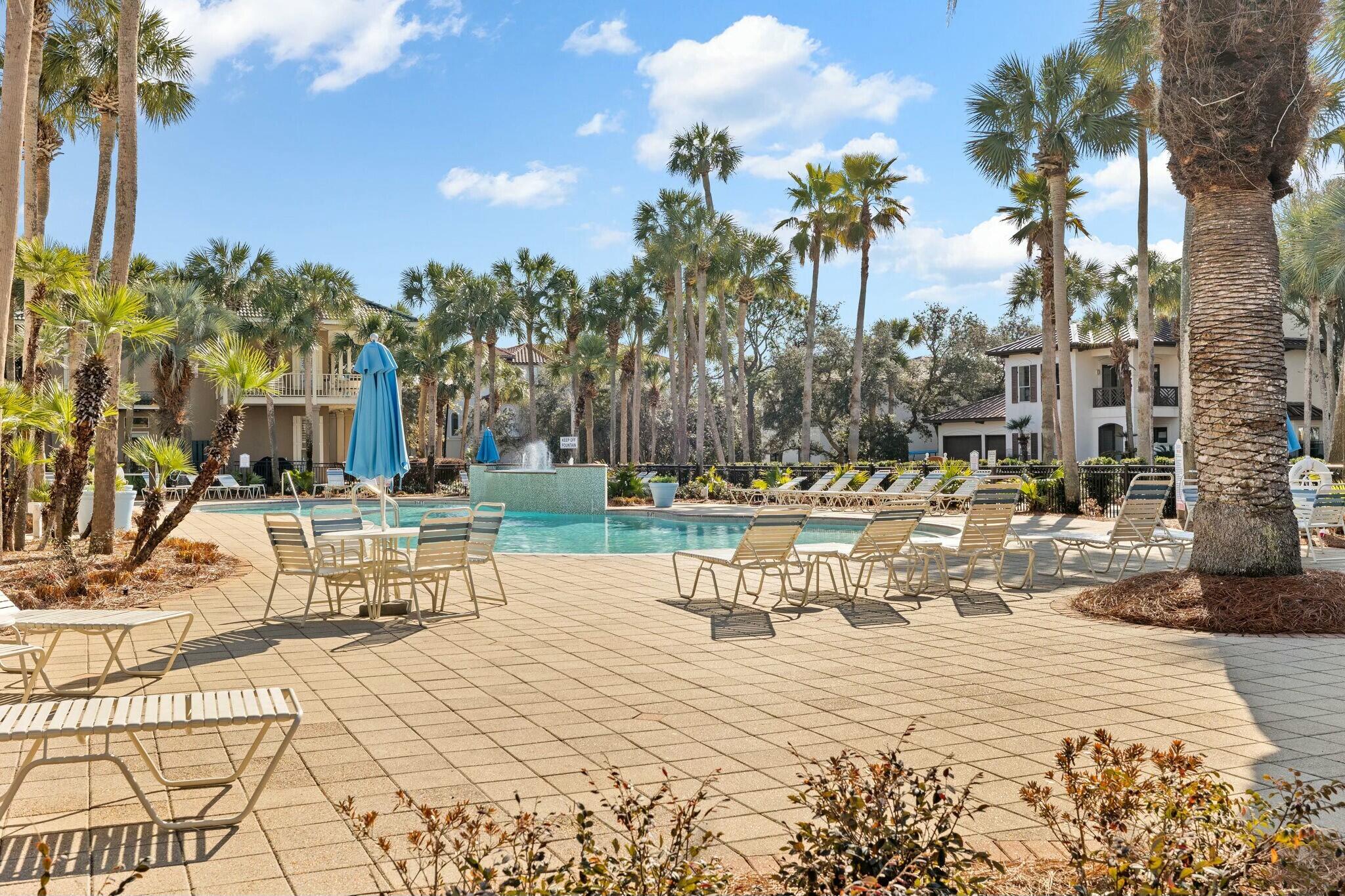 4596 Paradise Isle Destin, FL 32541 - Photo 56 of 60 a view of a swimming pool with a patio