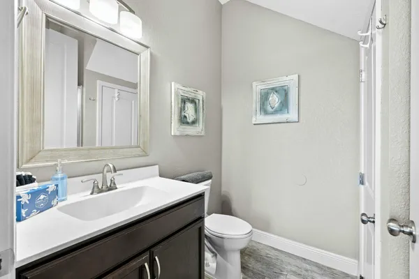 a bathroom with a glass shower door