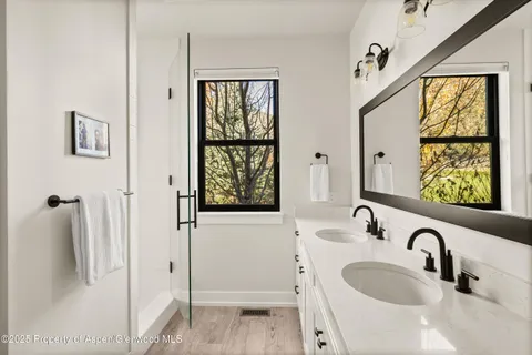 a bathroom with a sink and a large mirror