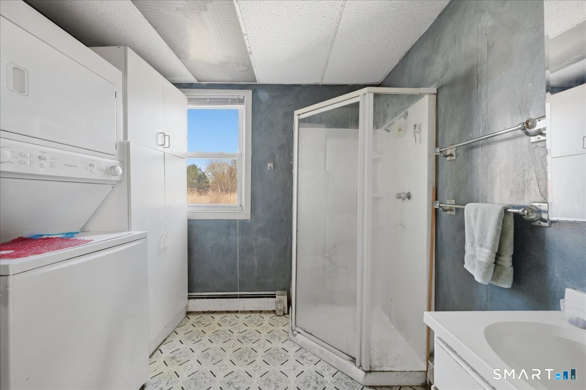 46 Hatch Street Stonington, CT 06355 - Photo 11 of 40 a bathroom with a shower and a sink