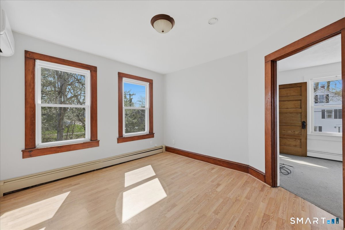 46 Hatch Street Stonington, CT 06355 - Photo 15 of 40 a view of an empty room with a window