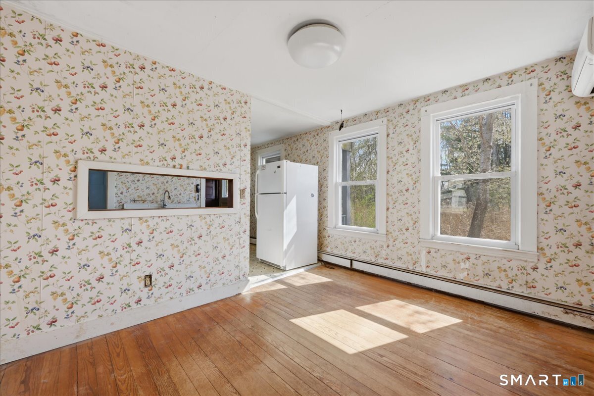 46 Hatch Street Stonington, CT 06355 - Photo 21 of 40 a view of empty room with wooden floor and fan