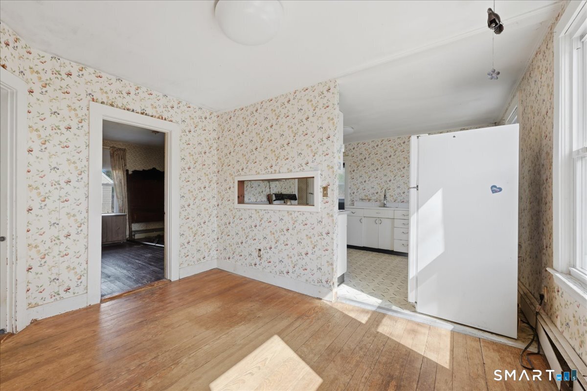 46 Hatch Street Stonington, CT 06355 - Photo 22 of 40 a bedroom with a bed and a stove top oven