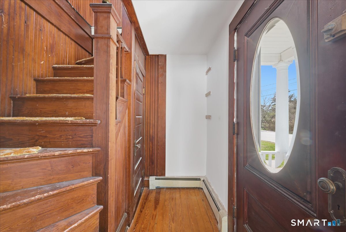 46 Hatch Street Stonington, CT 06355 - Photo 26 of 40 a view of front door with wooden floor