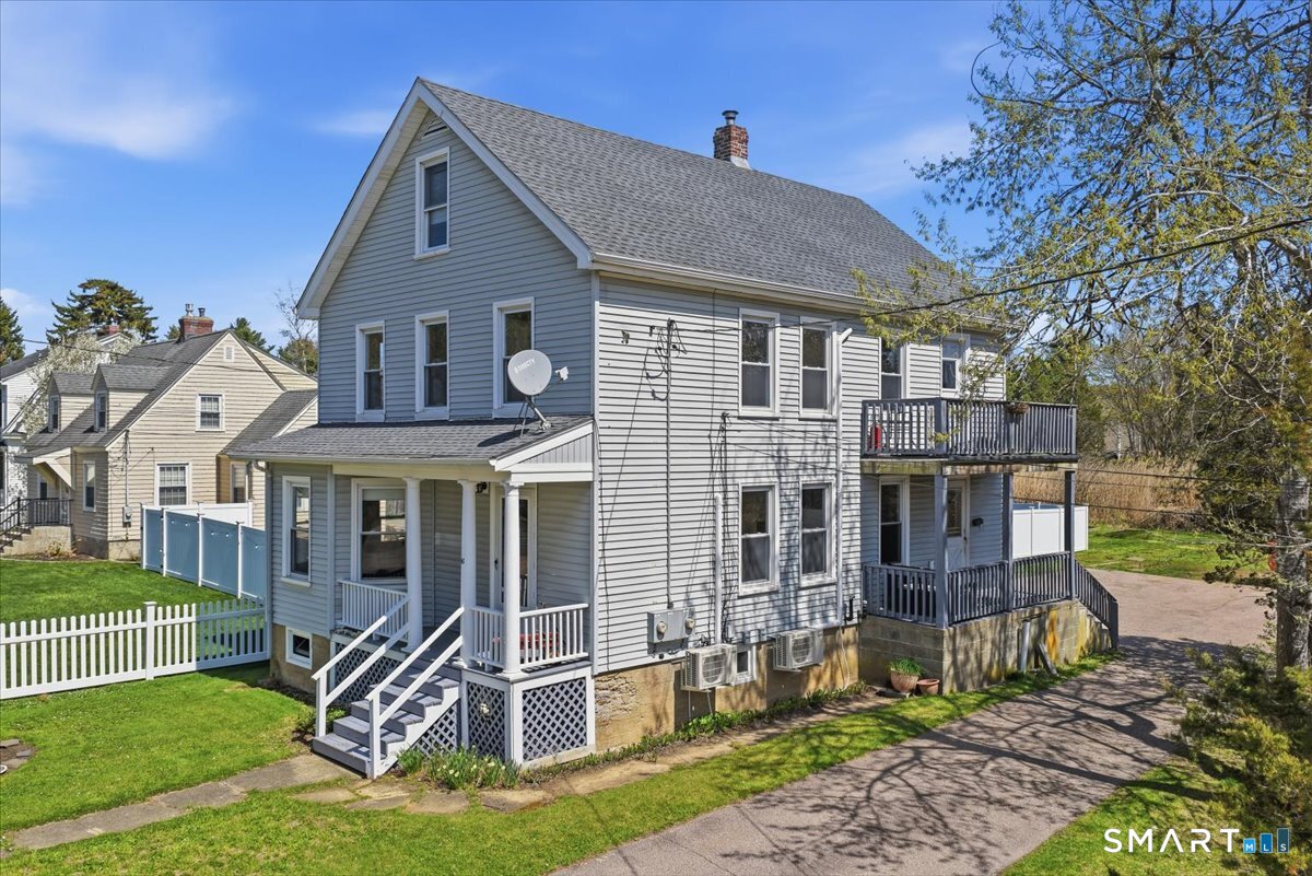 46 Hatch Street Stonington, CT 06355 - Photo 28 of 40 a front view of a house with a yard