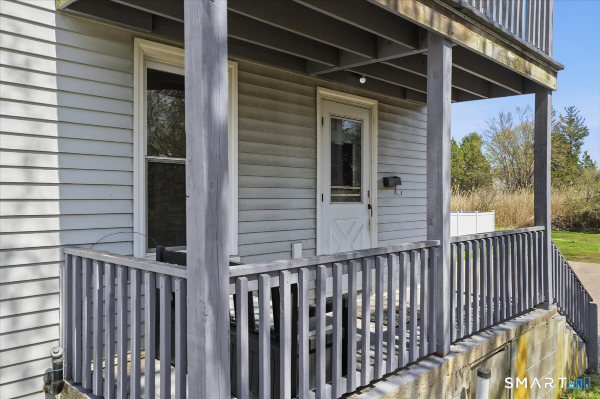 46 Hatch Street Stonington, CT 06355 - Photo 31 of 40 a view of a balcony with swing