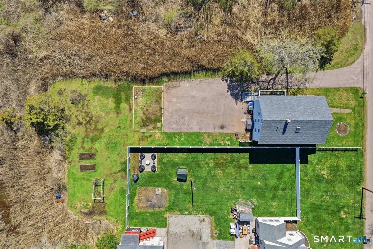 46 Hatch Street Stonington, CT 06355 - Photo 38 of 40 an aerial view of a house with a yard basket ball court and outdoor seating