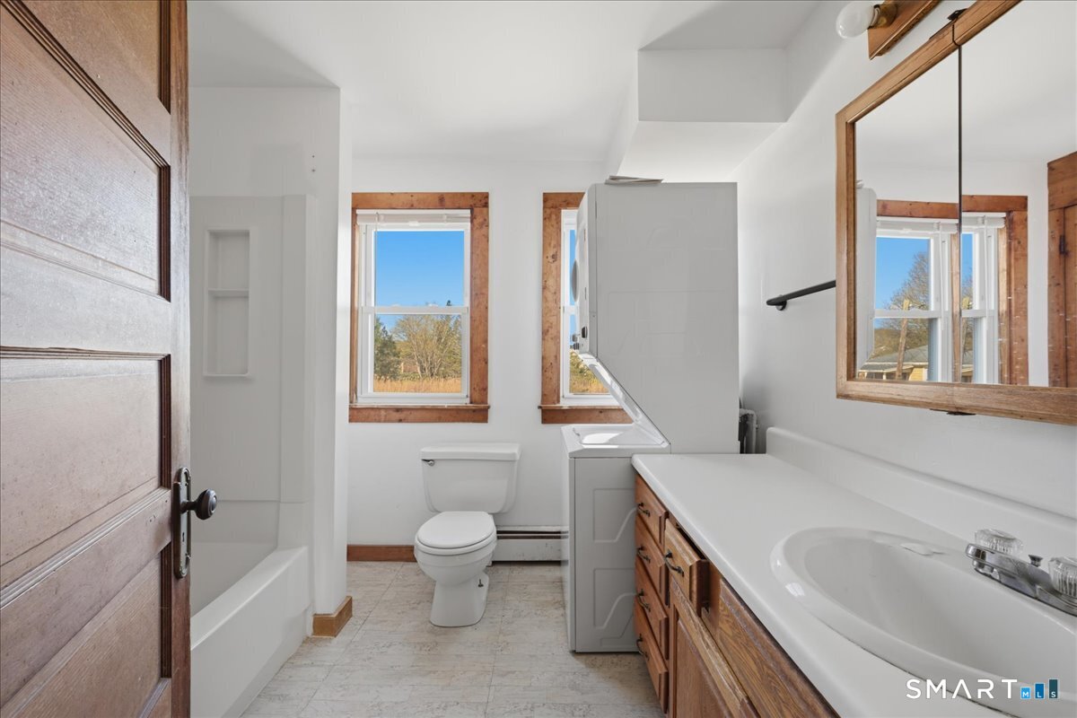46 Hatch Street Stonington, CT 06355 - Photo 9 of 40 a bathroom with a sink and a bathtub