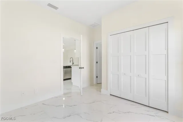 an empty room with a bathroom