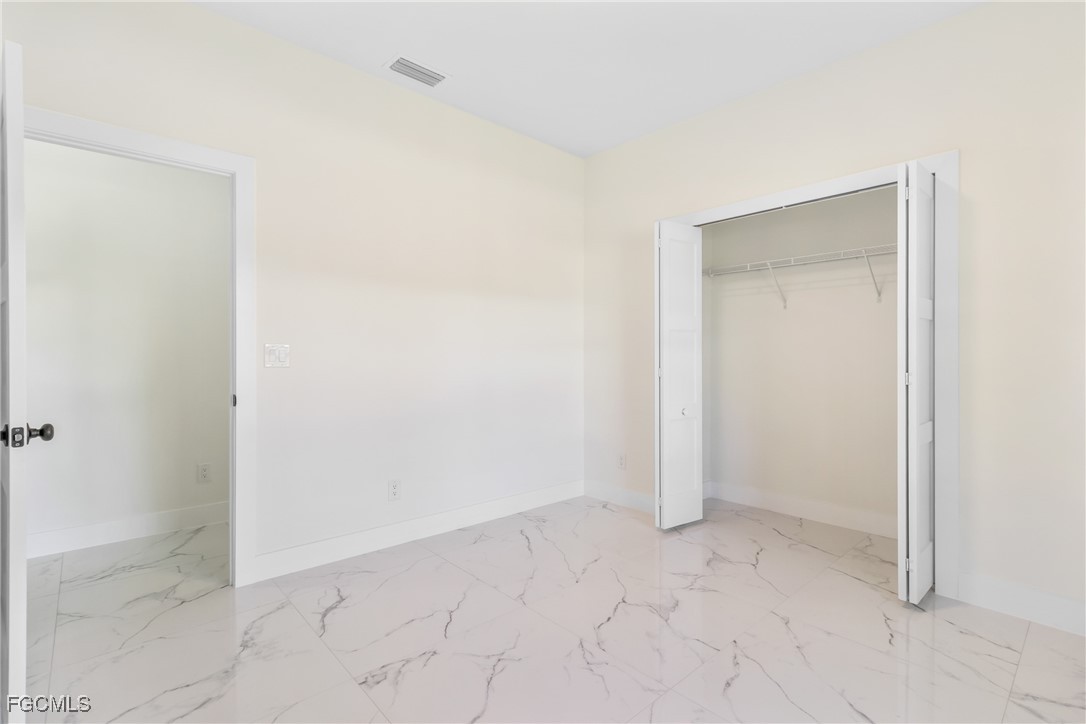 412 Fitch Avenue Lehigh Acres, FL 33972 - Photo 26 of 50 a view of an empty room
