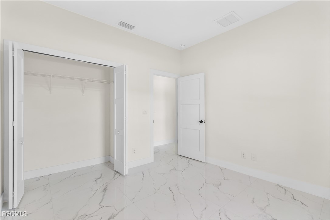 412 Fitch Avenue Lehigh Acres, FL 33972 - Photo 28 of 50 a view of an empty room