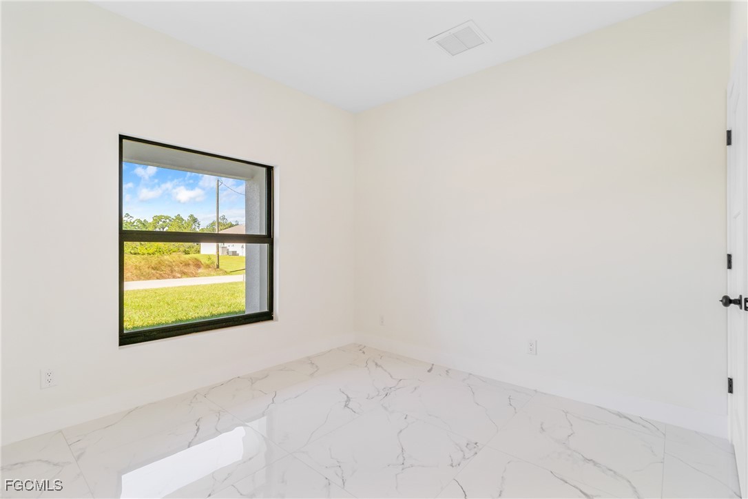 412 Fitch Avenue Lehigh Acres, FL 33972 - Photo 30 of 50 a view of a window in a room