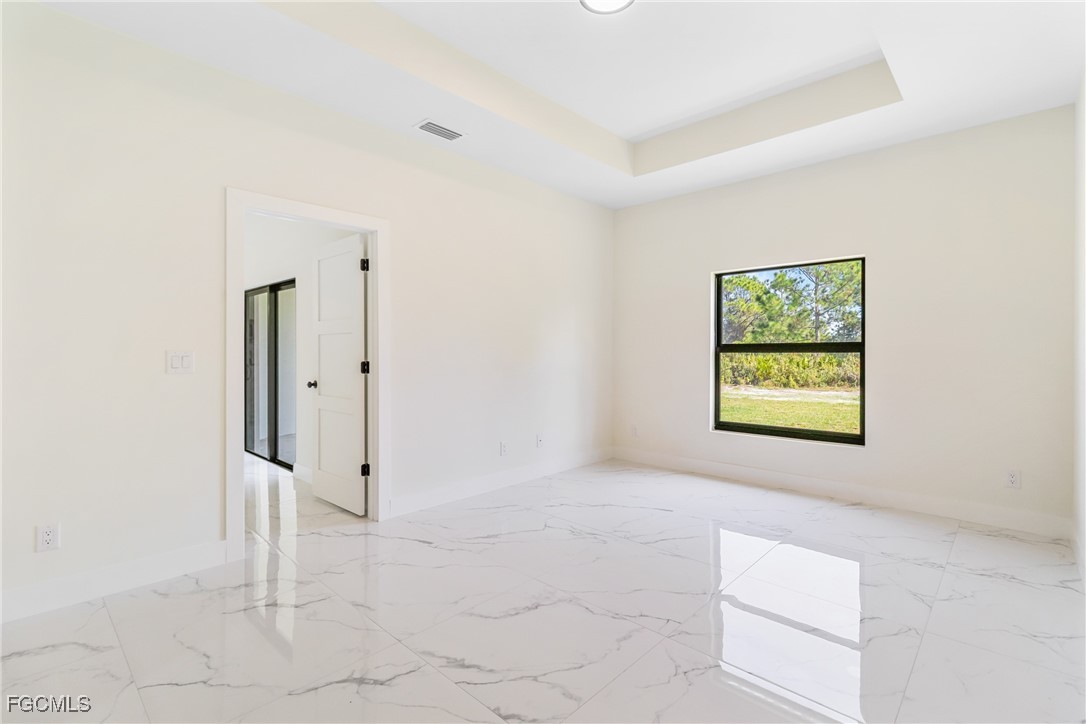 412 Fitch Avenue Lehigh Acres, FL 33972 - Photo 33 of 50 an empty room with windows and closet