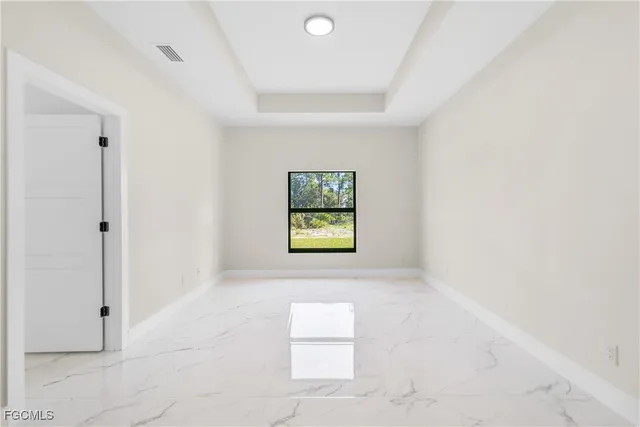 a spacious bathroom with a granite countertop sink a mirror and shower