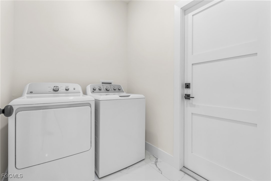 412 Fitch Avenue Lehigh Acres, FL 33972 - Photo 39 of 50 a utility room with dryer and washer