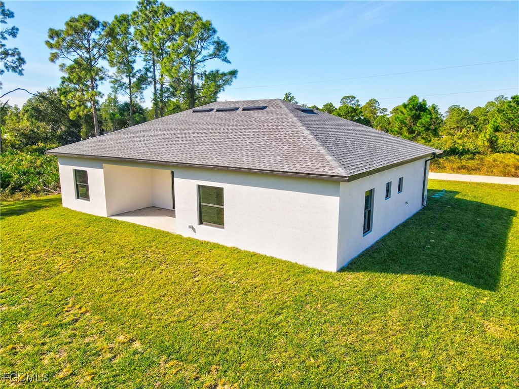 412 Fitch Avenue Lehigh Acres, FL 33972 - Photo 47 of 50 a house view with a garden space