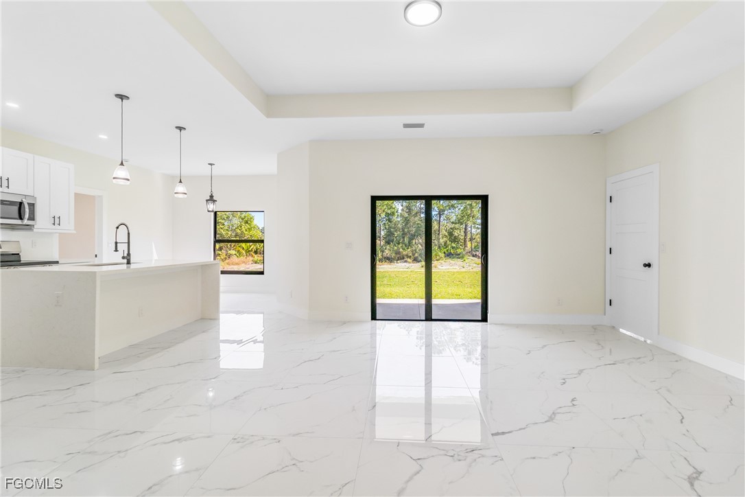 412 Fitch Avenue Lehigh Acres, FL 33972 - Photo 6 of 50 a view of an empty room with a window