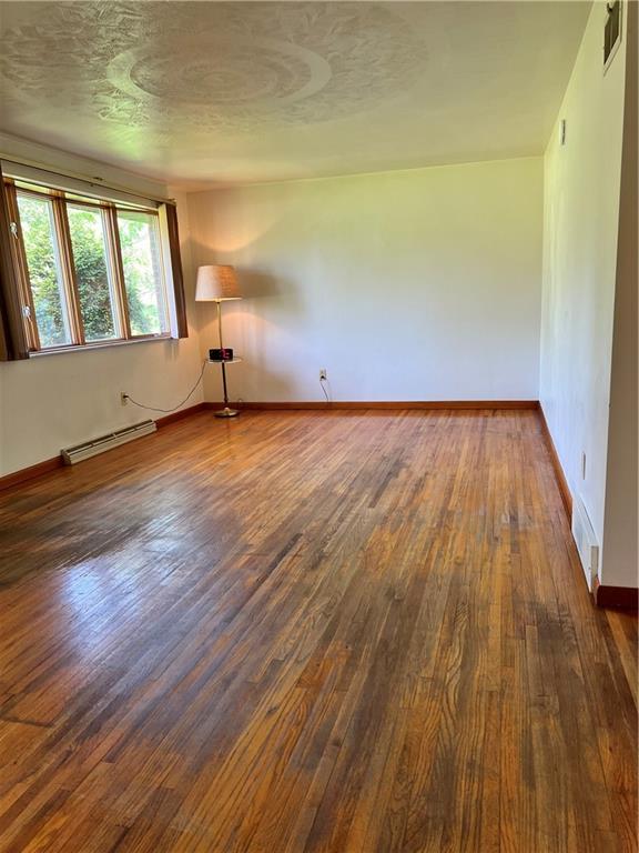 880 Pizza Barn Road Blairsville, PA 15717 - Photo 25 of 44 wooden floor in an empty room with a window