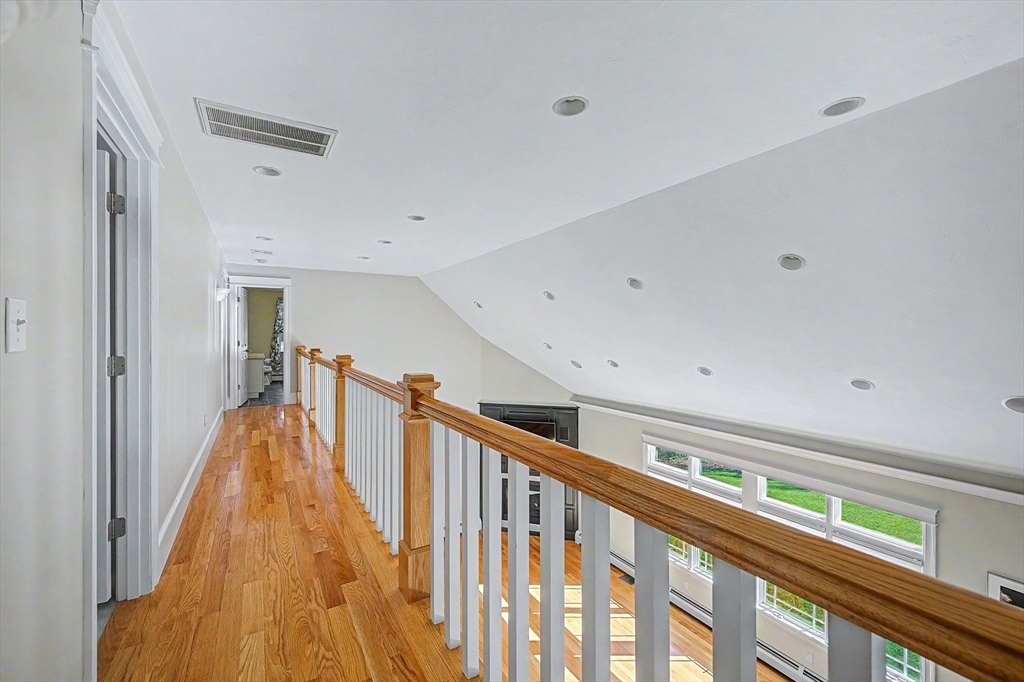 270 Mendon Road Sutton, MA 01590 - Photo 25 of 42 a view of a hallway with wooden floor