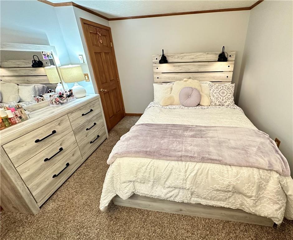 3021 Langley Road Uniontown, PA 15401 - Photo 13 of 28 a bedroom with a bed and a mirror on dresser