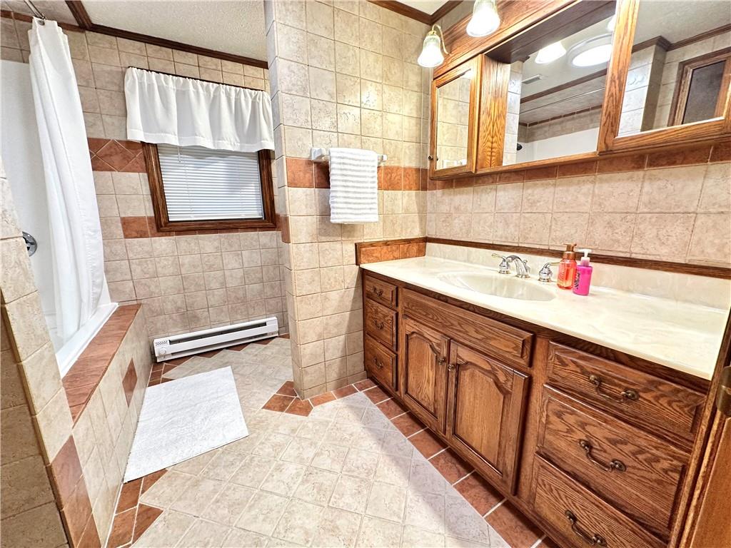 3021 Langley Road Uniontown, PA 15401 - Photo 14 of 28 a bathroom with a sink and a mirror