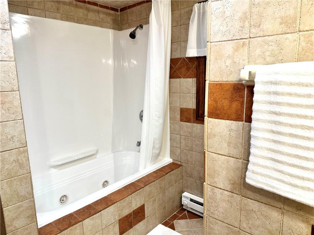 3021 Langley Road Uniontown, PA 15401 - Photo 15 of 28 a bathroom with a bathtub and a shower