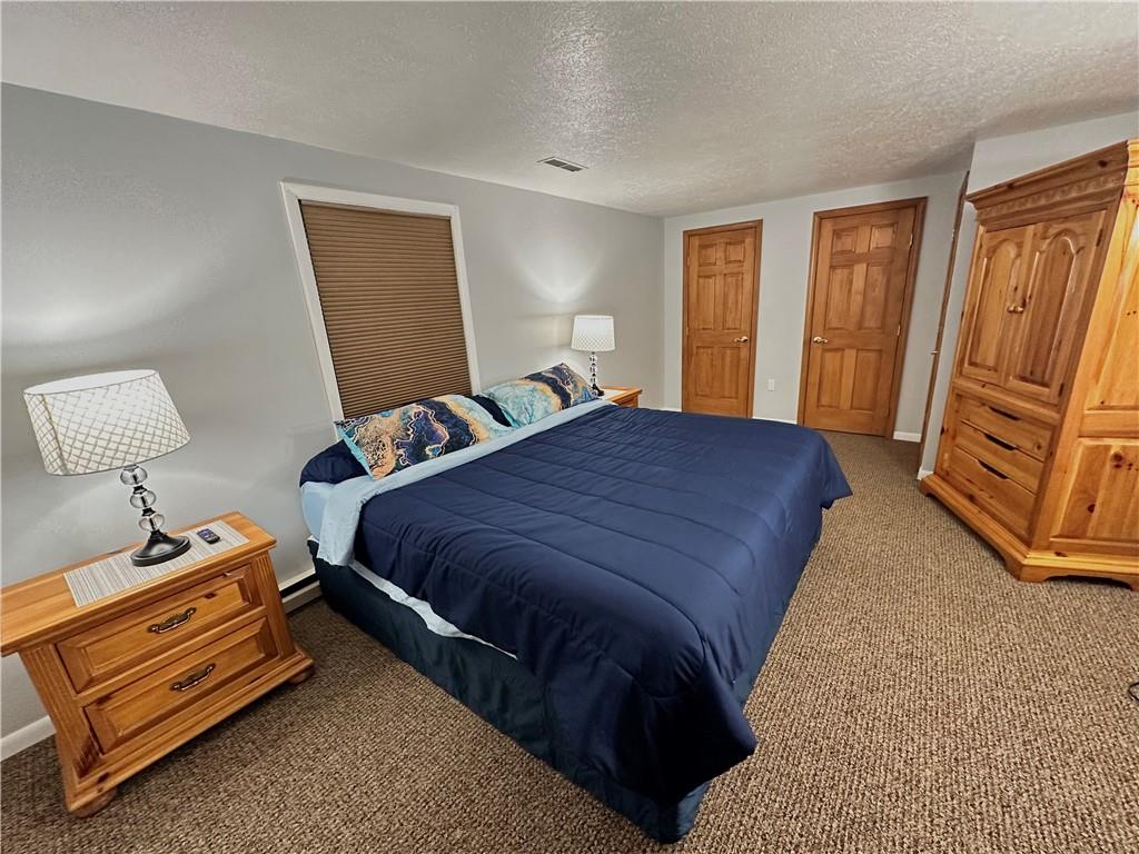 3021 Langley Road Uniontown, PA 15401 - Photo 17 of 28 a bedroom with a bed and wooden floor