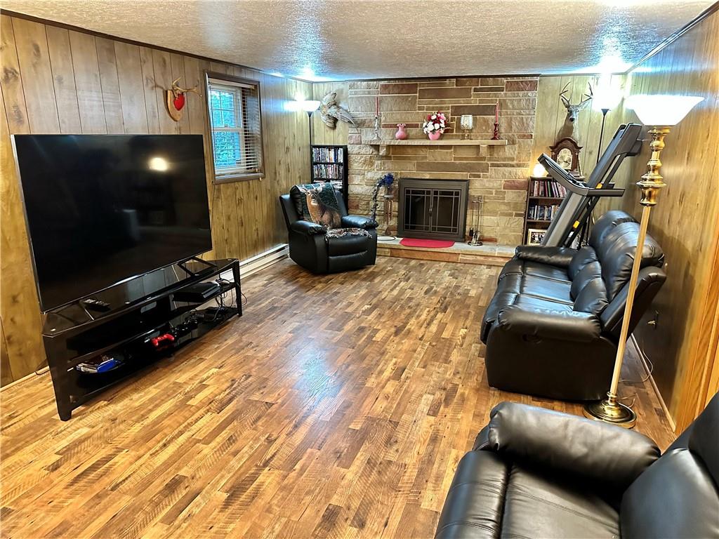 3021 Langley Road Uniontown, PA 15401 - Photo 20 of 28 a living room with furniture and a flat screen tv